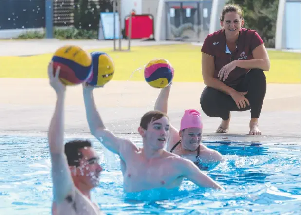  ?? Picture: STEWART McLEAN ?? NEW SKILLS: Australian women's water polo skipper Bronwen Knox assists Mitchell Cooican, Lloyd Lacey and Kat Kaposi at Tobruk Pool.