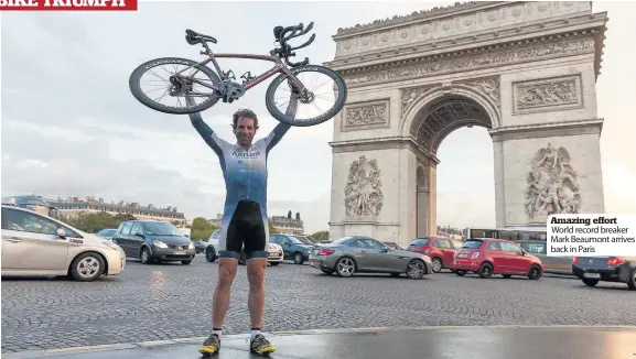  ??  ?? Amazing effort World record breaker Mark Beaumont arrives back in Paris