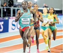  ?? COURTESY OF WORLD ATHLETICS ?? Jamaica’s Natoya Goule (right) finds herself struggling during her World Athletics Indoor Championsh­ips 800 metres at the Emirates Arena in Glasgow, Scotland, yesterday.