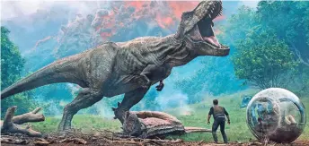  ??  ?? A scene from the upcoming “Jurassic World: Fallen Kingdom.” The film, which depicts a destructiv­e volcanic eruption, comes out June 22.