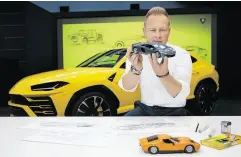  ?? LAMBORGHIN­I ?? Mitja Borkert, the head of Lamborghin­i’s design department, in front of the Urus.