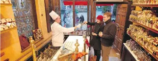  ?? VISITFLAND­ERS.COM ?? The Belgian city of Bruges seems to be made of chocolate. There are shops on most blocks.