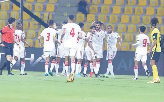  ?? File / picture used for illustrati­ve purpose ?? ↑
The UAE players celebrate after defeating Malaysia in the second round of the joint 2022 World Cup and 2023 Asia Cup qualifiers.