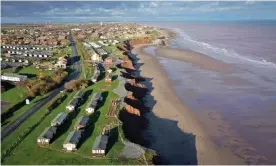  ?? Photograph: Christophe­r Furlong/Getty Images ?? Holiday chalets abandoned due to coastal erosion wait to be demolished or taken by the sea in the village of Withernsea in the East Riding of Yorkshire.