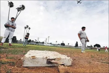  ?? Photograph­s by LUIS SINCO Los Angeles Times ?? THE SOFTBALL field at Morningsid­e High School in Inglewood has no bleachers and is choked with weeds.