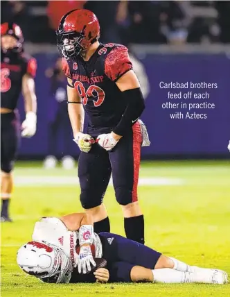  ?? DERRICK TUSKAN SAN DIEGO STATE ?? San Diego State junior defensive end Cam Thomas reacts to making a play against Fresno State.