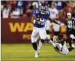  ?? ALEX BRANDON — THE ASSOCIATED PRESS Landover, Md. ?? New York Giants running back Saquon Barkley (26) breaks away from Washington Football Team cornerback Bobby Mccain (20) as he runs with the ball during the first half of an NFL football game, Thursday, Sept. 16, 2021, in