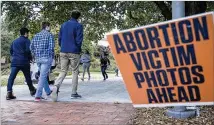  ?? ALYSSA POINTER/ATLANTA JOURNAL CONSTITUTI­ON ?? Many students opted to ignore the anti-abortion group’s presence on campus, while others noted that the images of alleged aborted fetuses were inaccurate.