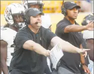  ?? Keith Srakocic / Associated Press ?? UCF coach Josh Heupel yells instructio­ns to his team during the second half against Pittsburgh last week.