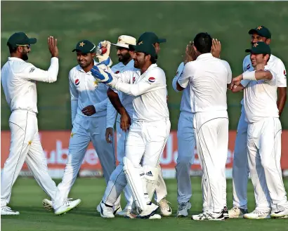  ?? Photo by Ryan Lim ?? pakistan captain Sarfraz Ahmed celebrates with his teammates after the dismissal of usman Khawaja of Australia. —