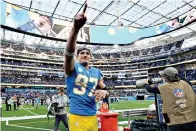  ?? AP Photo/Ashley Landis ?? ■ Los Angeles Chargers defensive end Joey Bosa (97) walks off the field after a win over the Denver Broncos on Sunday in Inglewood, Calif.