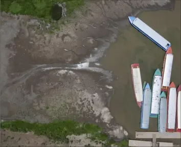  ?? Armando Solis/Associated Press ?? Boats are jammed against the bank of Lake Patzcuaro this month during the ongoing drought in Mexico. Activist Juan Manuel Valenzuela estimates that 90% of the boats used for fishing and to ferry tourists around currently are out of service because of dropping water levels.