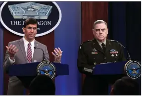  ??  ?? Defense Secretary Mark Esper (left), accompanie­d by Army Gen. Mark Milley, the chairman of the Joint Chiefs of Staff, holds a briefing Monday at the Pentagon. Esper said he approved the start of the U.S.’ troop withdrawal from Afghanista­n, even as the Taliban ordered a resumption of attacks on Afghan forces. More photos at arkansason­line.com/33esper/. (AP/Susan Walsh)