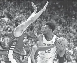  ?? JAMES CRISP/AP ?? Kentucky’s Keion Brooks Jr., right, is pressured Ohio’s Ben Vander Plas during the first half Friday in Lexington, Ky.