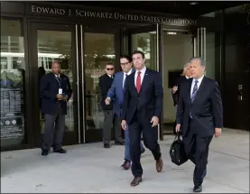  ?? AP PhoTo/gRegoRy Bul ?? Republican Rep. Duncan Hunter (center) wearing red tie, leaves court on Monday, in San Diego.