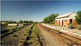  ?? ALL ABOARD! The whistle is no longer blown at Kendrew station (above) and the town is all but abandoned. Aloes and prickly pears dot the landscape, and church towers ring their bells to call the faithful to Sunday prayer. As you can see from our dirty Isu ??