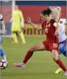  ?? TONY GUTIERREZ — THE ASSOCIATED PRESS ?? U.S. forward Carli Lloyd (10) and Russia midfielder Anna Cholovyaga compete for control of the ball during the first half of an internatio­nal friendly soccer match in Frisco, Texas, Thursday.