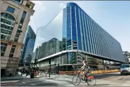  ?? BLOOMBERG ?? A cyclist passes by the new European headquarte­rs of Goldman Sachs Group Inc in London.