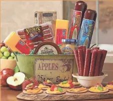  ?? WISCONSINM­ADE ?? WisconsinM­ade’s “Neuske’s Party Basket” features a variety of Neuske’s sausage, Wisconsin cheese and Wisconsin-made honey mustard and crackers.