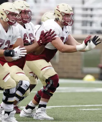  ?? Paul CONNOrs / BOstON Herald FIle ?? LOCAL PRODUCT: Boston College center Alec Lindstrom, a Dudley native, practices pass blocking during a scrimmage at Alumni Stadium last summer.