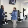  ?? MICHILEA PATTERSON — FOR DIGITAL FIRST MEDIA ?? Pottstown YMCA Senior Program Director Logan Finerfrock gives a tour of the renovated strength training room during the facility’s reopening and open house.