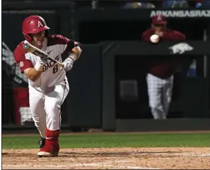  ?? NWA Democrat-Gazette/J.T. WAMPLER ?? Arkansas right fielder Eric Cole lays down a bunt Tuesday during the Razorbacks’ victory over Missouri State. Cole finished 0 for 3, but scored a run.