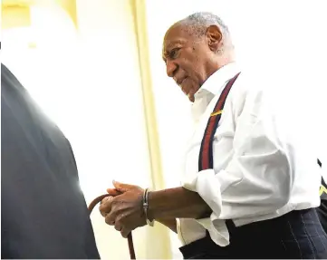  ?? — Reuters file photo ?? Cosby departs the Montgomery County Courthouse in handcuffs after being sentenced in his sexual assault trial on Tuesday in Norristown, Pennsylvan­ia.