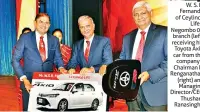  ??  ?? W. S. R. Fernando of Ceylinco Life’s Negombo 01 branch (left) receiving his Toyota Axio car from the company’s Chairman R. Renganatha­n (right) and Managing Director/ceo Thushara Ranasinghe