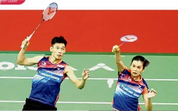  ??  ?? Itching for action: Chan Peng Soon (left) and Goh Liu Ying are among the 10-man Malaysian squad to go into action against Ghana in the mixed team event today.