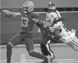  ?? BRANDON WADE/ASSOCIATED PRESS ?? Cleveland wide receiver Odell Beckham Jr. breaks a tackle by Dallas middle linebacker Jaylon Smith to score one of his three touchdowns Sunday in a 49-38 Browns victory.