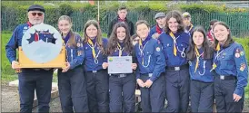  ?? ?? Presentati­on of Shield to Mitchelsto­wn Scout Patrol, l-r: John Fitzgerald (County Commission­er), Alisa, Kaya, Eliza, Kevin, Eleanor, Holly and Aine.