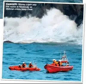  ??  ?? DANGER: Waves crash into the rocks at Newquay as lifeboat crews keep clear