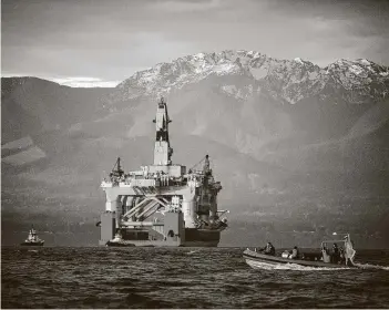  ?? Associated Press file photo ?? The drilling unit Transocean Polar Pioneer arrives aboard a transport ship in Port Angeles, Wash., in 2015. Transocean is the world’s biggest owner of deep-water oil rigs.