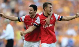  ?? Photograph: Nick Potts/PA ?? Mikel Arteta (left) celebrates with Aaron Ramsey after Arsenal’s 3-2 victory against Hull in the 2014 FA Cup final.