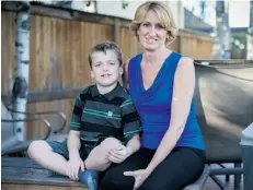  ?? Adrian Shellard/Postmedia News ?? Calgary executive Evelyn Studer, shown with her son Cayden, says prices are “still reasonable” in the Phoenix area.