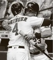  ??  ?? George Springer and Michael Brantley became close the last two years. Now they go their separate ways.