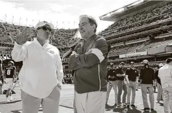  ?? Sam Craft / Associated Press ?? After opening at home at a 30 percent capacity Kyle Field against Vanderbilt on Sept. 26, Texas A&M and coach Jimbo Fisher, left, will visit Alabama and coach Nick Saban on Oct. 3.