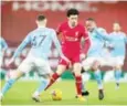  ?? ?? Liverpool’s Curtis Jones being sandwiched by Manchester City’s Phil Foden and Raheem Sterling in a recent clash