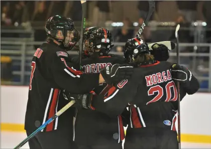  ?? KYLE FRANKO — TRENTONIAN PHOTO ?? Robbinsvil­le/Allentown players celebrate after a goal against Lawrence/Hightstown/Ewing during a CVC ice hockey game at Mercer Rink in West Windsor.