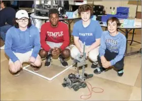  ?? JESI YOST - DIGITAL FIRST MEDIA ?? Exeter School District sophomores Reid Martin, Ryu Morgan, Nicholas Ciabattoni, and Colin Pinkerton pose with their VEX Robot.