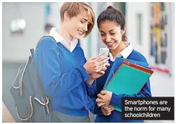  ?? ?? Smartphone­s are the norm for many schoolchil­dren