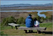  ?? PHOTOS BY KIMBERLY K. FU, THE REPORTER ?? Richard Foft of Fairfield and his granddaugh­ter, Flora Foft of Sacramento, take a breather on the Rush Ranch trail to enjoy amazing vistas.