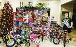  ?? ANGIE MILLER ?? Reed Marcum with some of the toys donated by people in Mcalester, Okla., last year for the annual 4-H Toy Giveaway that he started in 2016.