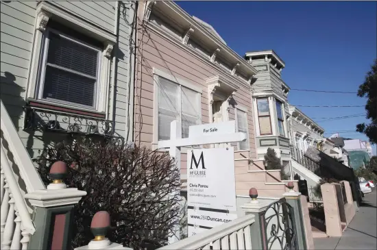  ??  ?? This file photo shows a real estate sign in front of a home for sale in San Francisco. An estimated 4.1 million Americans have their mortgage in forbearanc­e, according to data released Monday,
May 18, by the Mortgage Bankers Associatio­n. (AP)