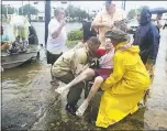  ?? STEVE GONZALES — HOUSTON CHRONICLE ?? Neighbors used personal boats Sunday to rescue Jane Rhodes in Friendswoo­d, Texas.