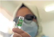  ?? AFP ?? A medical worker prepares to inoculate a woman with a dose of Covishield, AstraZenec­aOxford’s Covid-19 vaccine, at a vaccinatio­n centre in Srinagar yesterday.