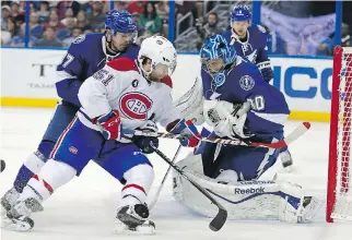  ?? MI K E C A R L S O N / T H E A S S O C I AT E D P R E S S ?? Tampa Bay Lightning goalie Ben Bishop makes a save on Montreal Canadiens’ David Desharnais on March 16. The Lightning have dominated the Habs 4- 0 this season.