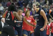  ?? JESSICA HILL — THE ASSOCIATED PRESS ?? Washington Mystics’ Elena Delle Donne, right, celebrates a play with Ariel Atkins, left, and Natasha Cloud, center, during Game 4 of basketball’s WNBA Finals against the Connecticu­t Sun, Tuesday in Uncasville, Conn.