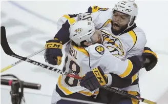  ?? AP PHOTO ?? THE REAL DEAL: James Neal (18) celebrates his overtime goal with P.K. Subban that gave the Predators the 3-2 victory against the Ducks last night.