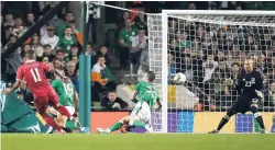  ?? AP ?? Serbia’s Aleksandar Kolarov (left) scores the winning goal against Republic of Ireland during the European Group D qualifying match at the Aviva Stadium in Dublin, Ireland yesterday.